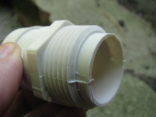 Photo of the hose adapter, held in my hand