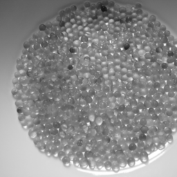 A bowl of small glassy beads.